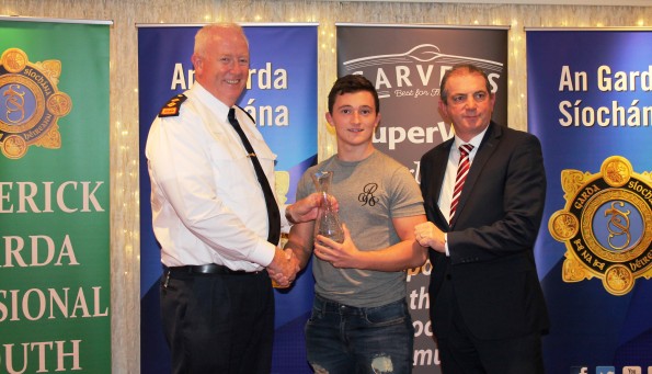  Above: Craig was presented with his Garda Youth Award by Chief Superintendent Gerard Roche (left( and Kevin McCarthy, Garvey Group who sponsor the awards.