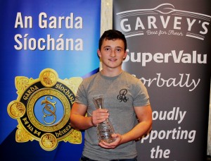 Craig O'Brien with his Garda Volunteer Youth Award 